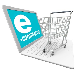 A laptop computer with the word e-Commerce on the screen